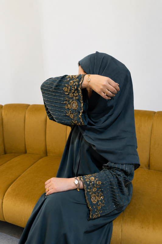 Tela emerald green closed abaya with wide sleeves, gold floral crystal work and diagonal beading